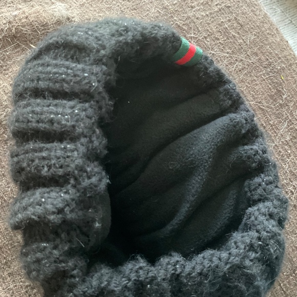 Gucci black shiny knit hat.
